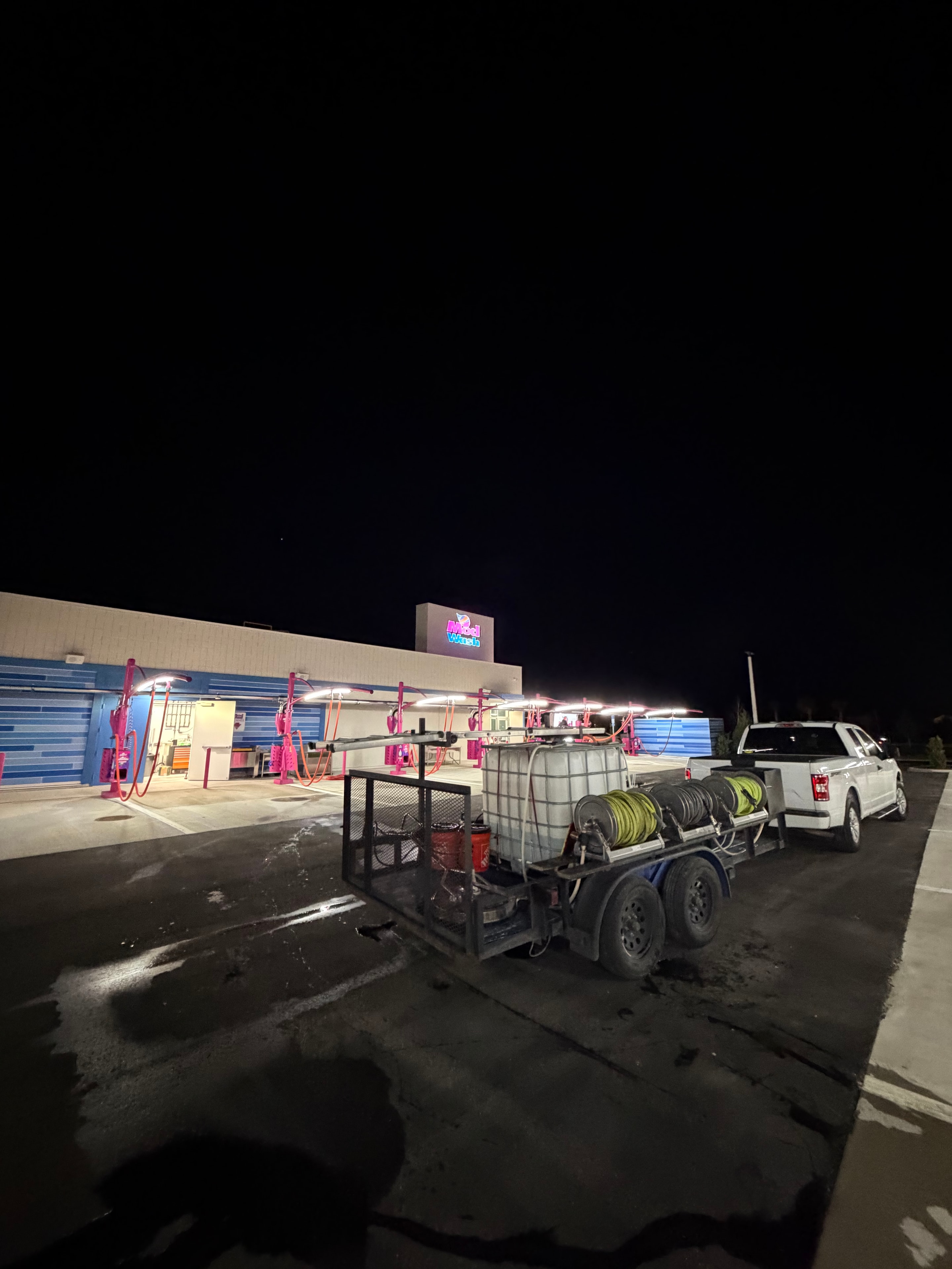Seal Deal Pressure Washing equipment trailer staged outside commercial storefront at night, Jacksonville, FL