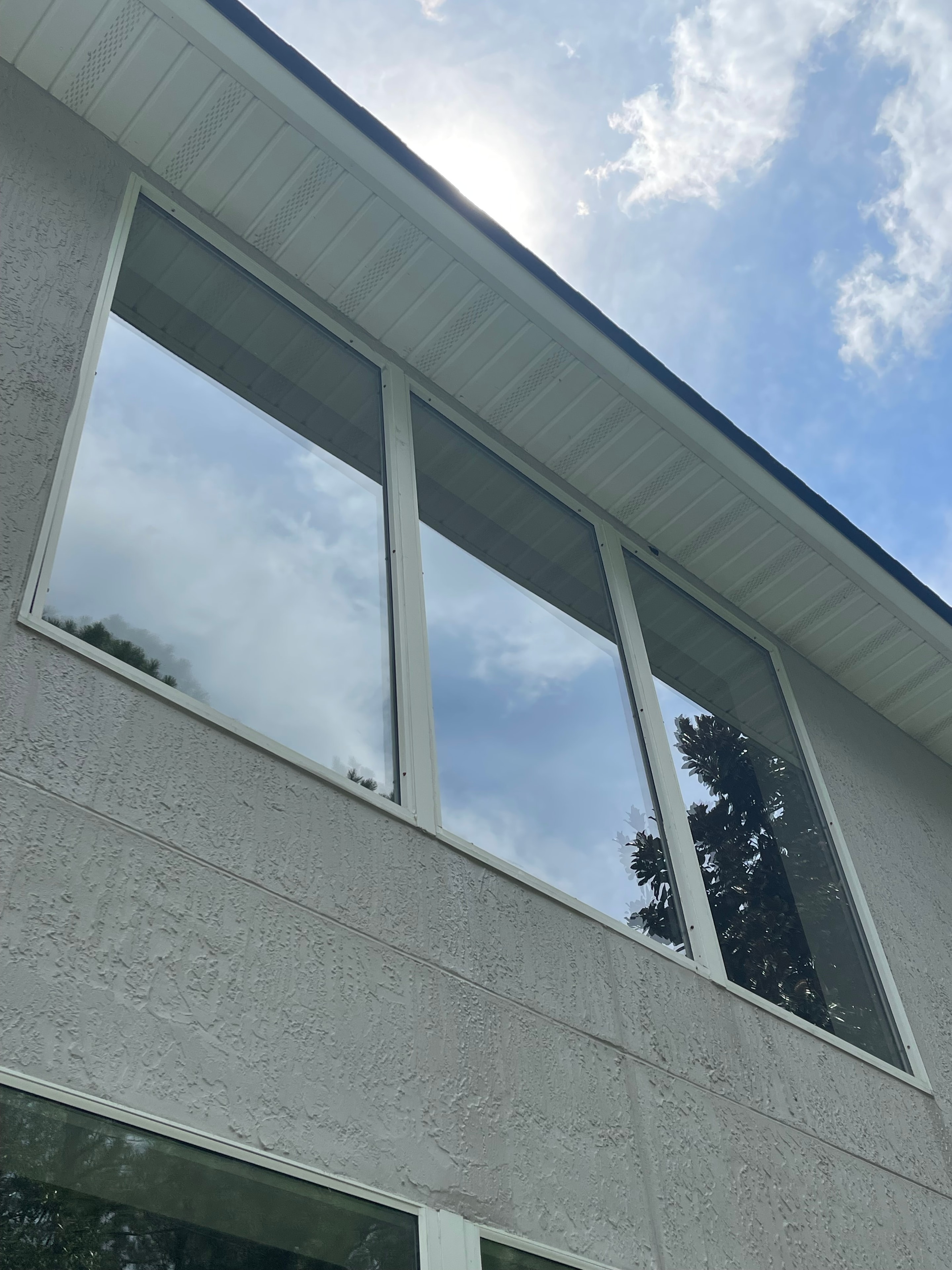 Commercial building windows after professional cleaning — crystal clear glass and bright white frames, Jacksonville, FL